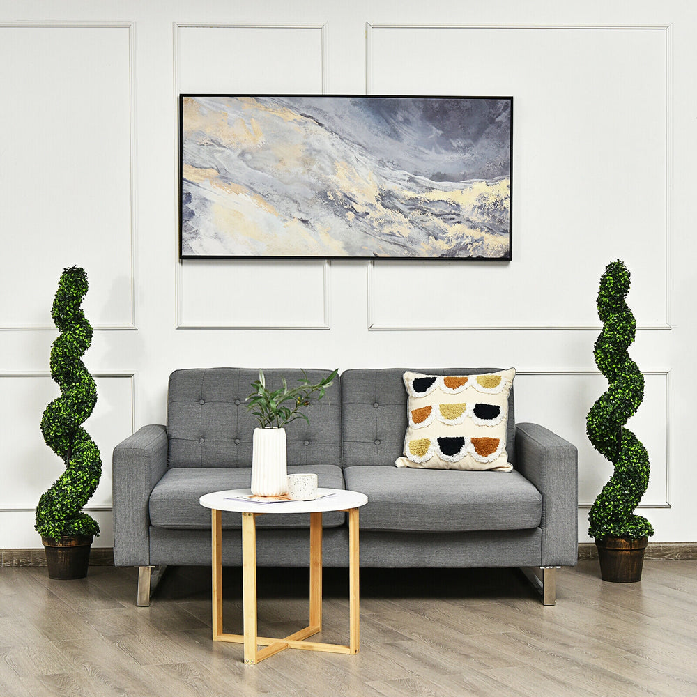 Artificial 4 FT spiral boxwood topiary in a golden pot, perfect for indoor or outdoor decor, adding a natural touch.