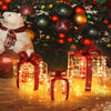 Lighted Christmas gift boxes in three sizes, adorned with red ribbons, creating a festive atmosphere with 60 LED lights.