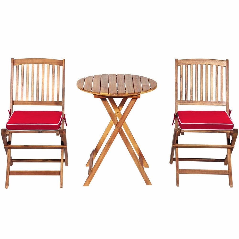 Folding acacia wood chair with red padded cushion, designed for ergonomic comfort and easy outdoor storage.