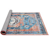 Rolled-up view of a 5 x 7 inch distressed vintage area rug in blue and orange, showcasing its compact design for.