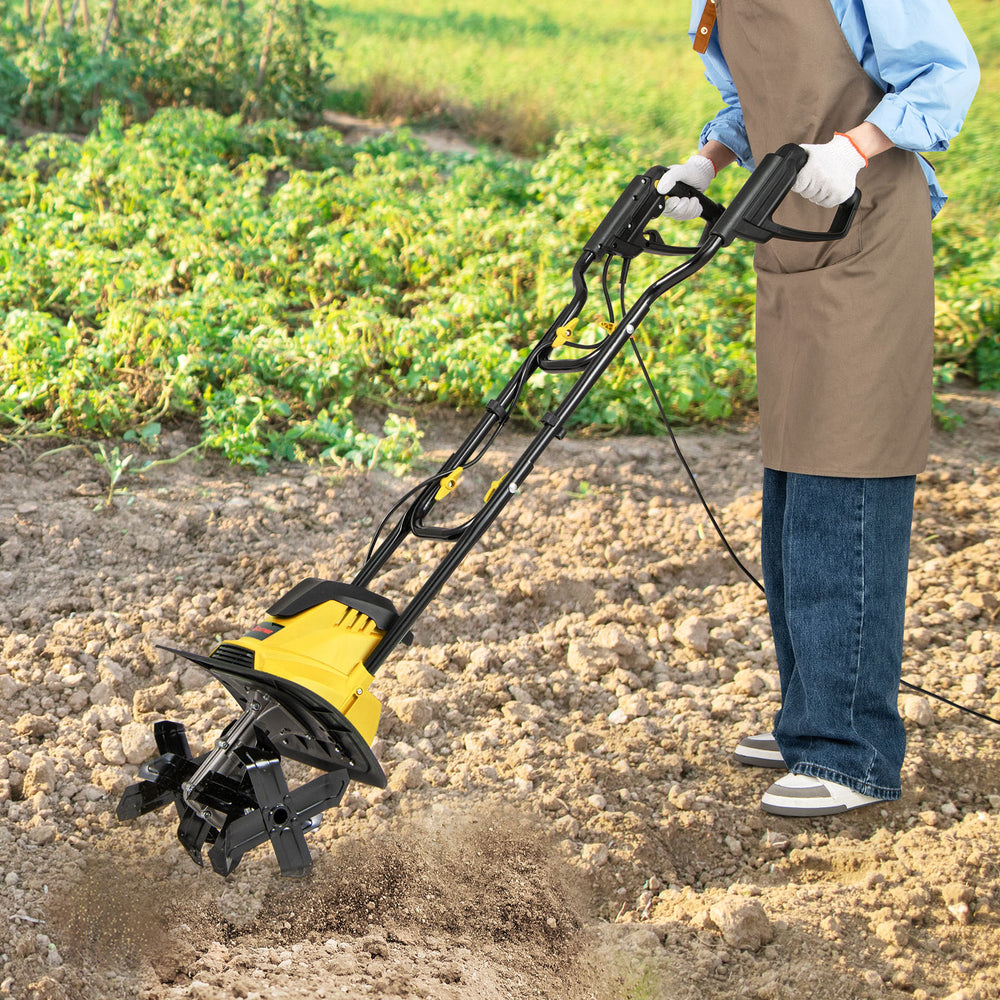 Electric tiller cultivator with 10 Amp motor and 4 angled tines, ideal for efficient soil digging in gardens.