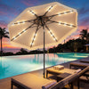 10 FT beige solar LED patio umbrella with lights, providing shade by the pool for evening gatherings and relaxation.