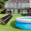 Weatherproof solar swimming pool heating system with PE material, placed on grass for efficient year-round heating.