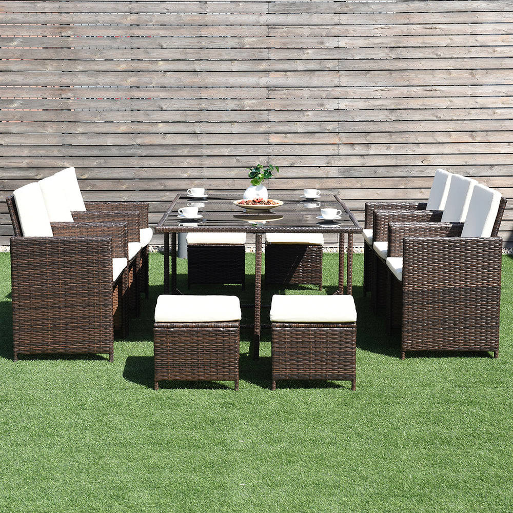 10-piece outdoor patio dining set featuring brown PE wicker chairs and ottomans, perfect for garden or poolside use.