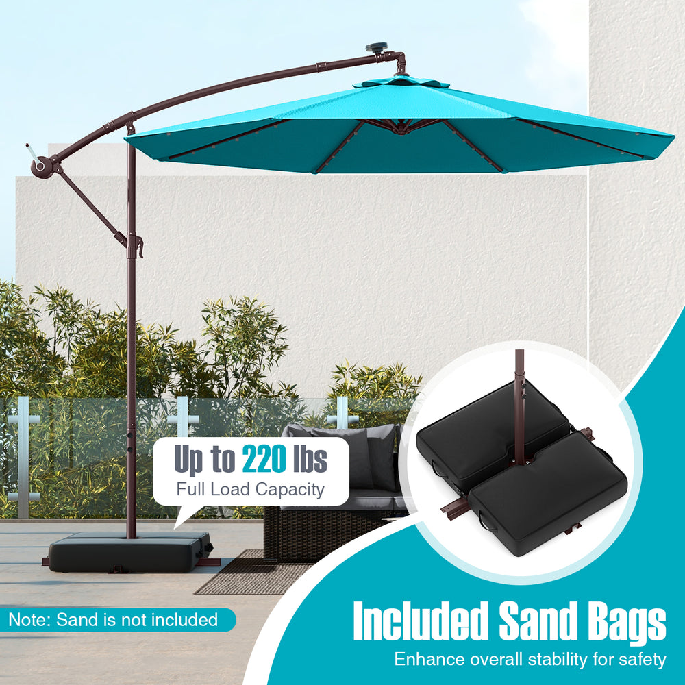 Turquoise 10 ft offset cantilever umbrella with solar lights and included sand bags for enhanced stability in outdoor.