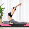 Folding exercise mat in black and pink, 10x4 feet, ideal for stretching and gymnastics with durable PU leather cover.