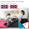 Folding exercise mat in black and pink, featuring hook and loop fasteners, ideal for kids' play and various workouts.