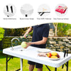 Folding cleaning sink table with sprayer, HDPE tabletop, and quick-connect faucet for outdoor cleaning tasks.