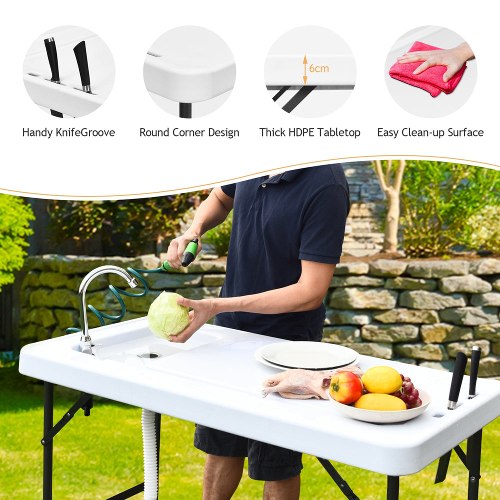Folding cleaning sink table with sprayer, HDPE tabletop, and quick-connect faucet for outdoor cleaning tasks.