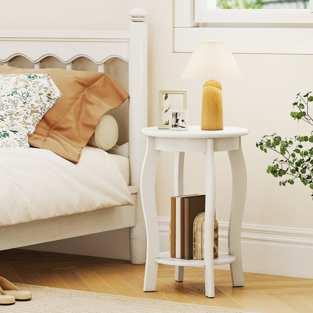Round 2-tier end table in white with rubber wood legs, perfect for bedroom or living room storage and charm.