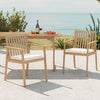 Two acacia wood patio dining chairs with removable cushions, perfect for outdoor relaxation on the porch or patio.