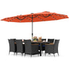11-piece patio dining set featuring a large orange LED umbrella, black PE rattan chairs, and acacia wood tabletop for.