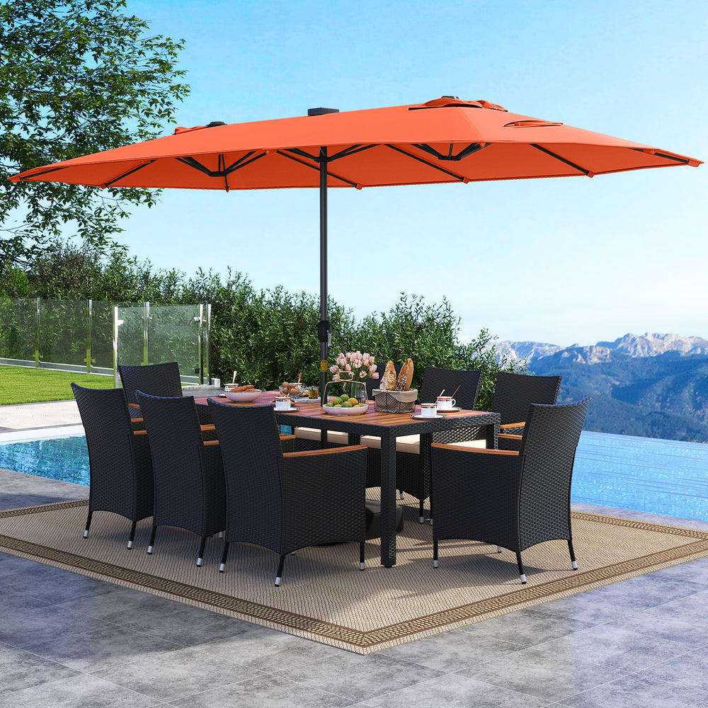 Patio dining set with a spacious acacia wood table and stackable rattan chairs, complemented by a vibrant orange LED.