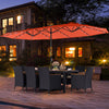Patio dining set featuring an 11-piece configuration with an orange LED umbrella, cushioned chairs, and acacia wood.