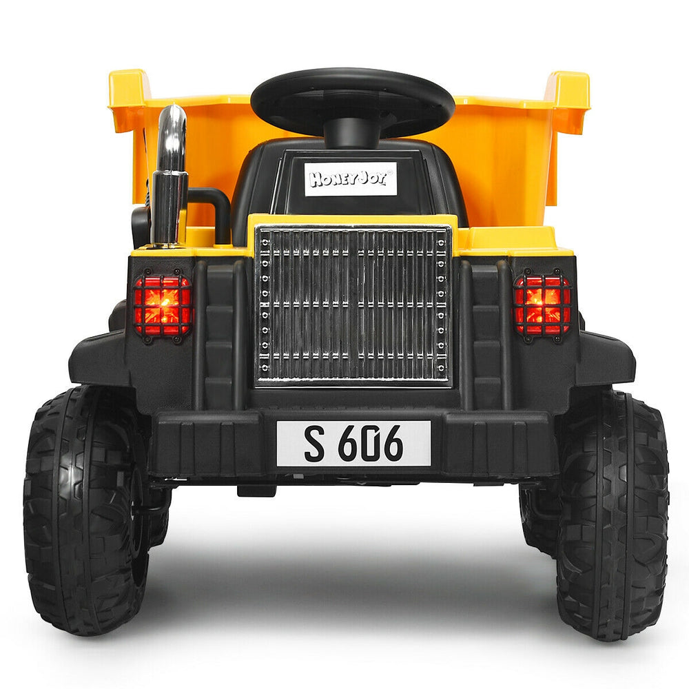 Rear view of the yellow 12V kids ride-on dump truck with electric bucket, featuring bright LED lights and rugged tires.