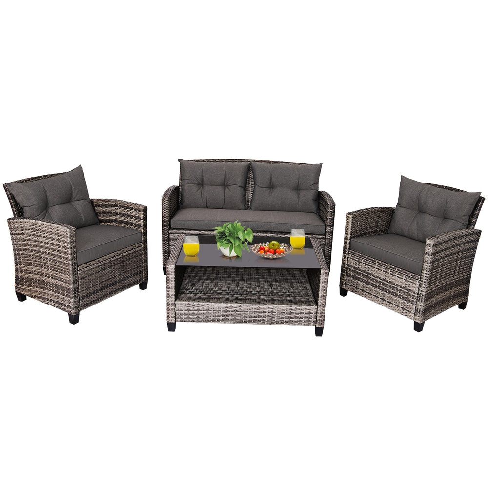 4-piece patio rattan furniture set with gray cushioned loveseat, two chairs, and coffee table for outdoor relaxation.