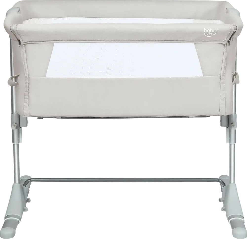 Portable beige baby bedside crib with adjustable heights, detachable sidebar, and breathable mesh for safe sleeping.