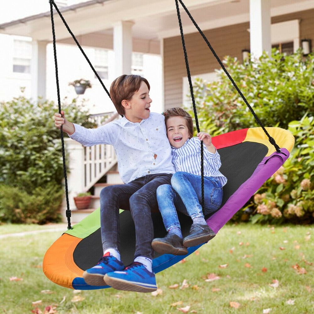 Colorful 60-inch saucer swing with two kids enjoying outdoor play, adjustable height for versatile hanging options.