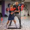 Kids punching bag with adjustable stand and gloves, featuring a soft red and black ball for safe training and.