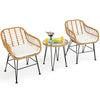 Round coffee table with a tempered glass top and stylish rattan design, ideal for serving drinks in outdoor settings.