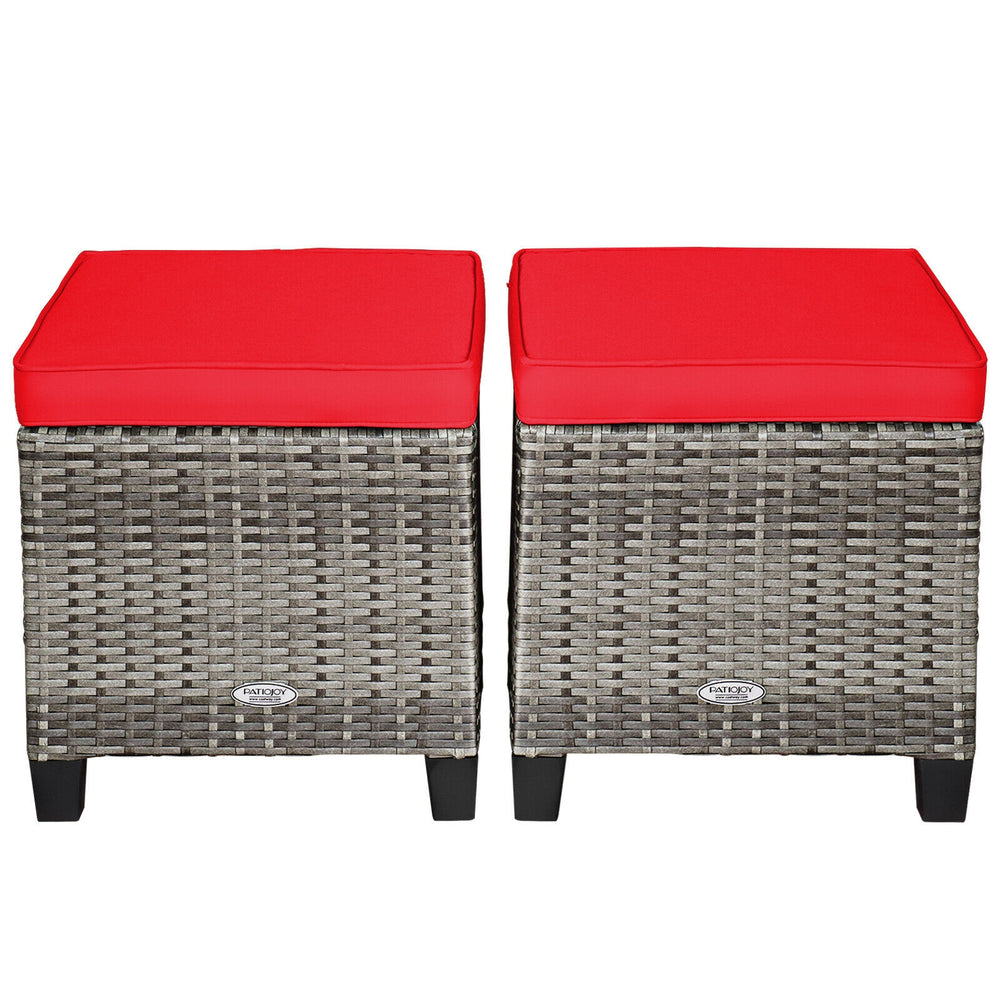 Set of 2 patio rattan wicker ottomans with red removable cushions, perfect for outdoor use in garden or poolside.
