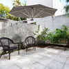 Wall-mounted 8ft tan sun shade umbrella with adjustable angle and heavy-duty aluminum frame for outdoor patio use.