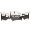 4-piece patio rattan furniture set featuring cushioned loveseat and chairs with a storage coffee table, ideal for.