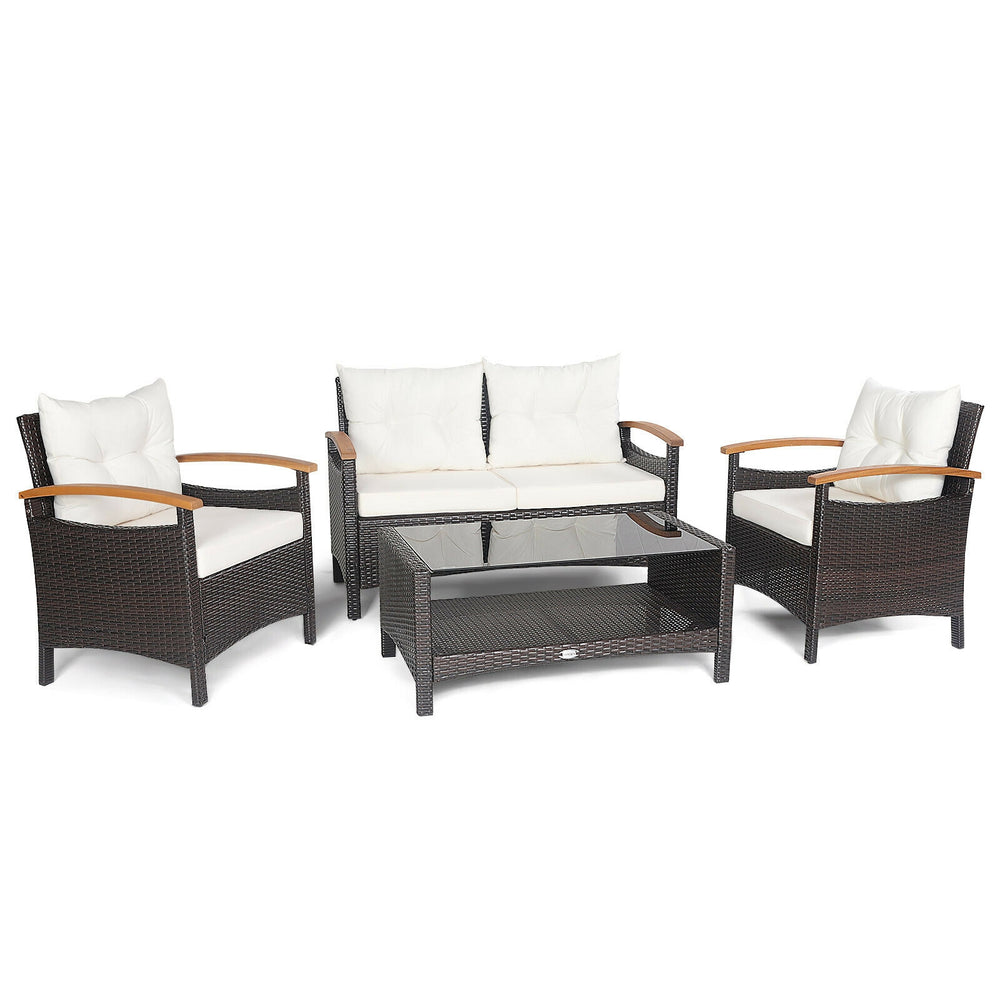 4-piece patio rattan furniture set featuring cushioned loveseat and chairs with a storage coffee table, ideal for.