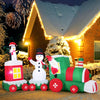 Christmas inflatable train featuring Santa Claus, snowman, and penguin, made of weather-resistant fabric for outdoor.