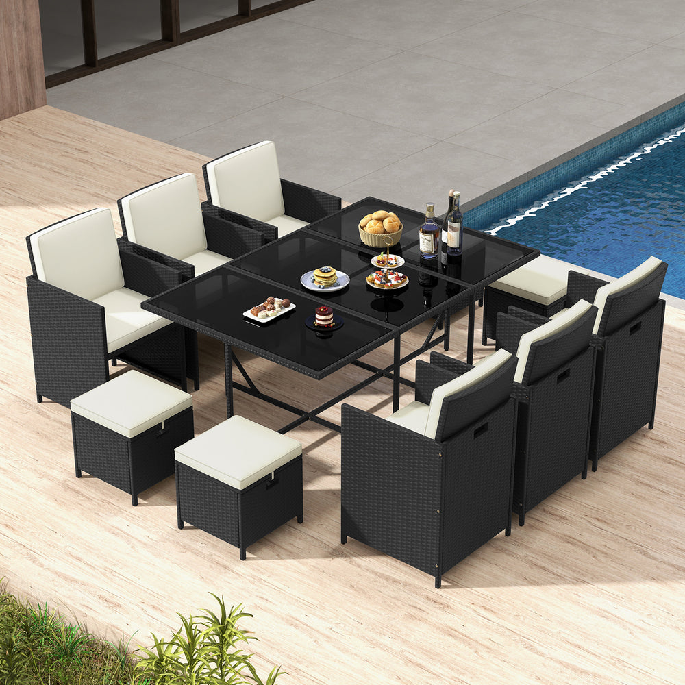 11-piece patio dining set featuring black wicker chairs and a tempered glass table, ideal for outdoor gatherings.