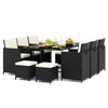 11-piece patio dining set featuring black wicker chairs and a tempered glass table with waterproof cushions for outdoor.