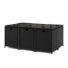 Black wicker dining table with tempered glass top, featuring a space-saving design for outdoor patio use.