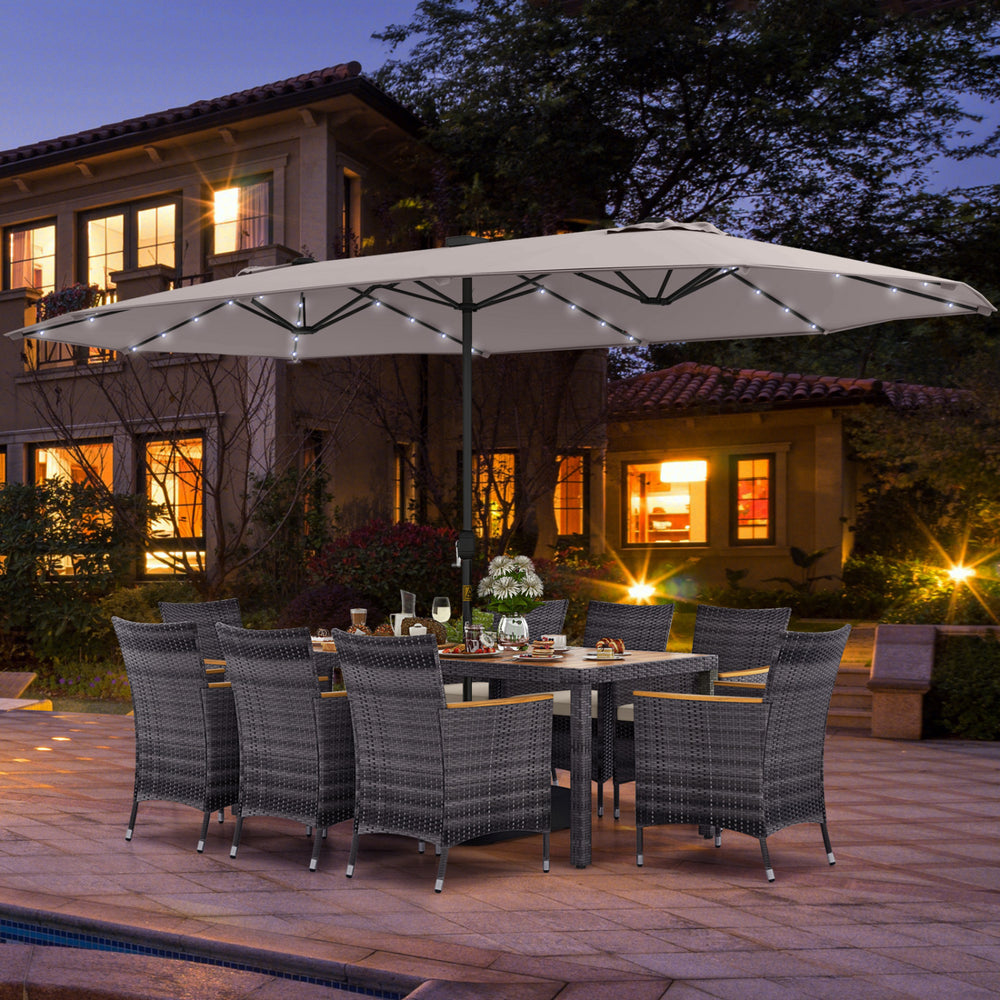 Close-up of a gray PE rattan chair with soft cushion and ergonomic backrest, part of the 11-piece patio dining set for.