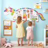 Children engaging with the 11-in-1 dinosaur activity wall busy board, featuring a xylophone and various learning.