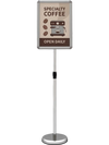 Height adjustable SUPERBUY sign holder stand with a snap-open frame, ideal for displaying menus and notices in restaurants.