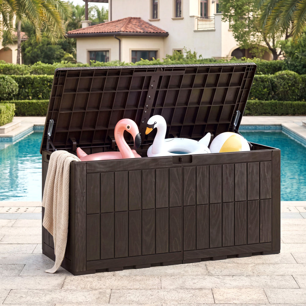 Outdoor deck box with lid, holding pool floats, made of durable brown PP, ideal for garden tools and seating.