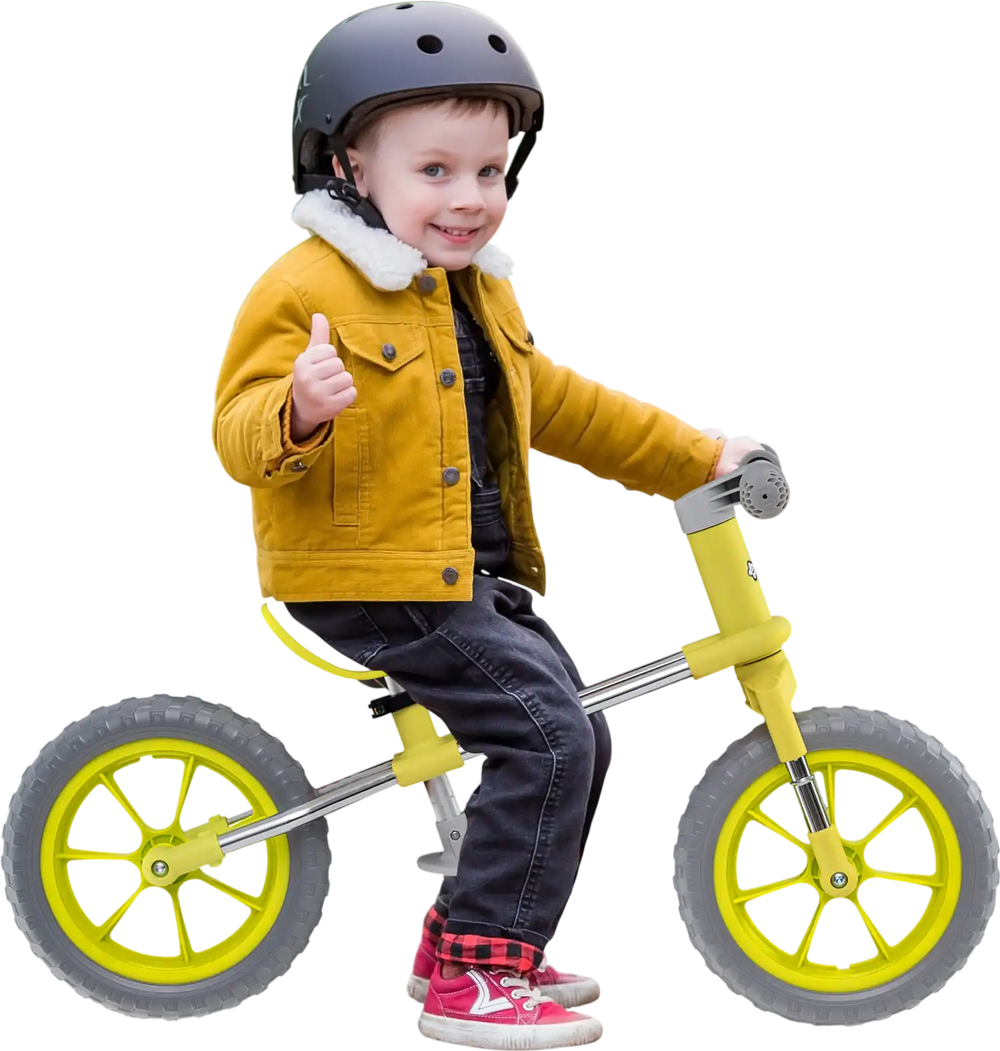 Child riding a 12-inch balance bike with adjustable seat and rotatable handlebar, perfect for developing balance skills.