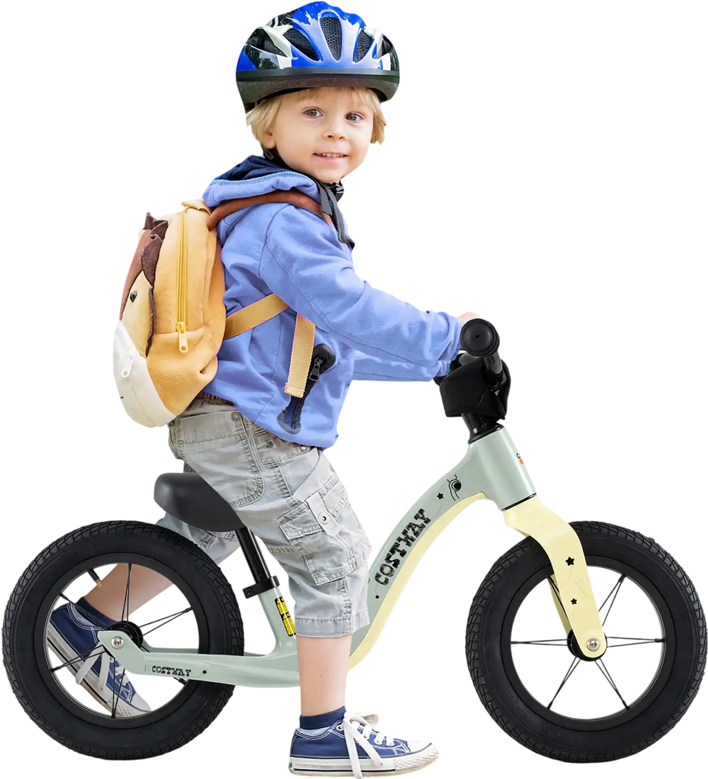 Child riding a 12-inch green balance bike with adjustable seat and rotatable handlebar, perfect for kids over 36 months.