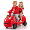 Two children riding a red 12V Chuggington train with adjustable seat, music features, and storage compartment.