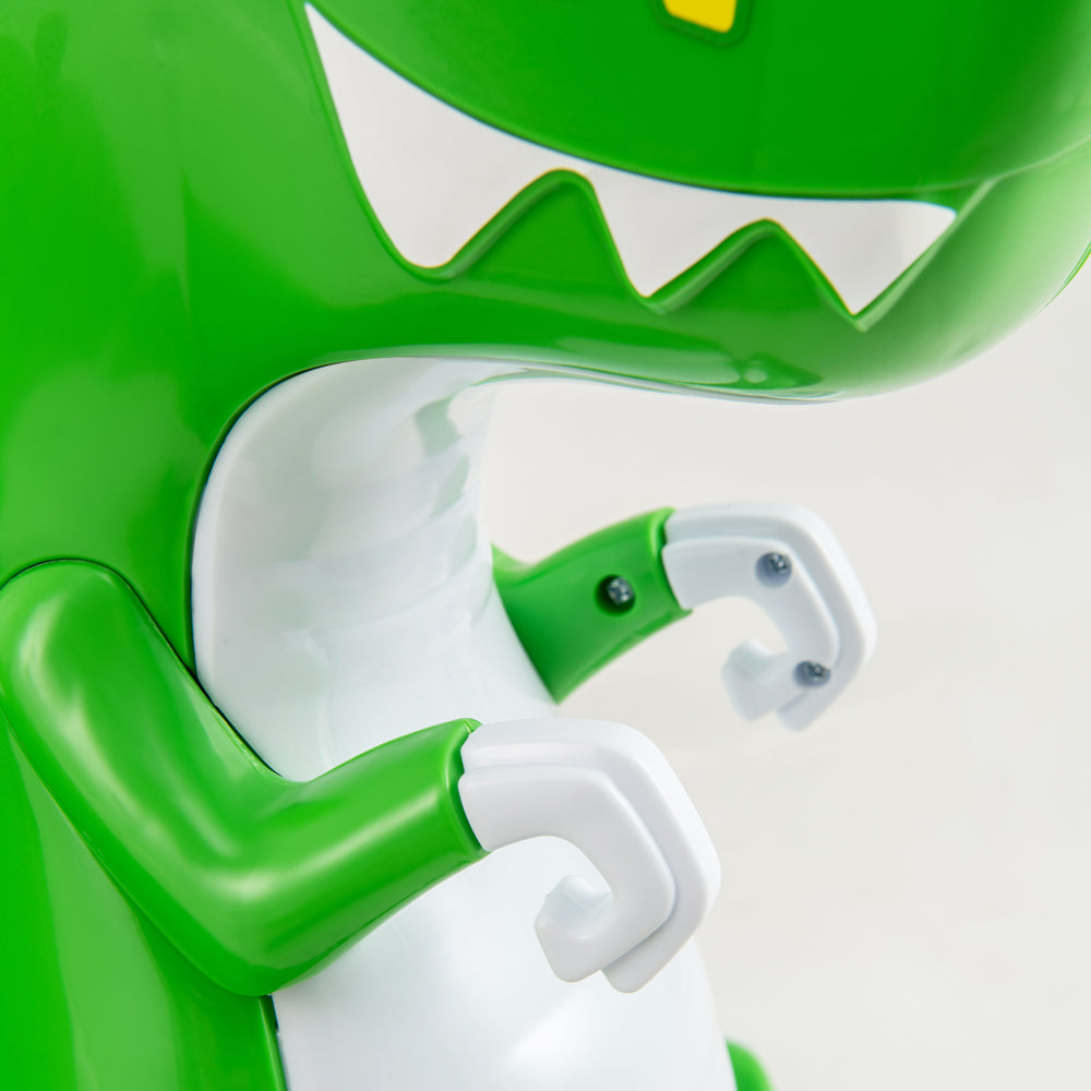 Close-up of the green dinosaur bumper car's arms, featuring safety design and kid-friendly controls for toddlers.