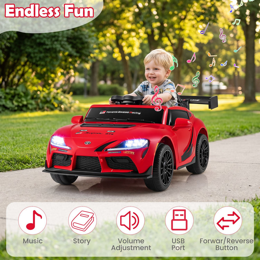 Red 12V kids electric car with licensed Toyota styling, shown in a front three-quarter view with a child and music features.