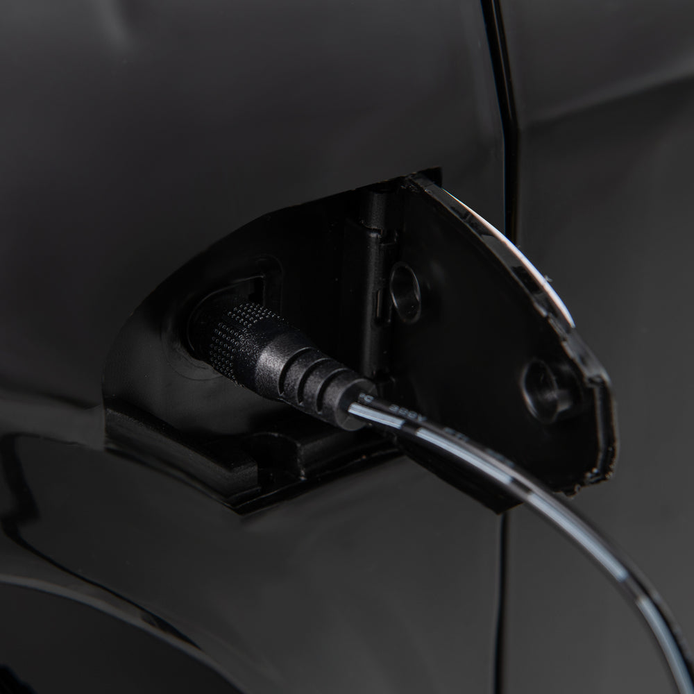 Close-up of the hidden charging hole for the 12V Kids Ride on Car Audi SQ8 in black, designed for easy charging.