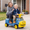 Kids ride-on train in blue with detachable carriage, featuring a smiling design and a parent seat for outdoor fun.