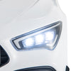 Close-up of the LED headlights on the white 12V Kids Ride on Car Mercedes-Benz AMG CLA 45 for enhanced visibility.