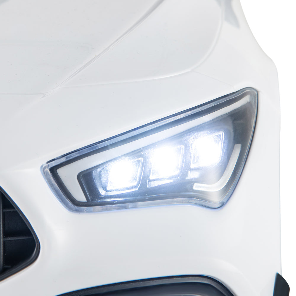 Close-up of the LED headlights on the white 12V Kids Ride on Car Mercedes-Benz AMG CLA 45 for enhanced visibility.