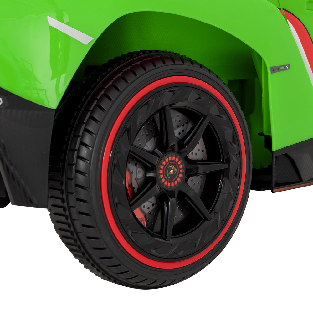 Close-up of the black and red wheel of the 12V licensed Lamborghini kids ride-on sports car for stable driving.