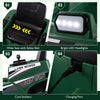 Wide seat with safety belt on a green 12V ride-on lawn mower for kids, featuring LED headlights and charging port.
