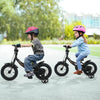 Kids riding 12-inch black bike with removable training wheels, adjustable seat, and safety features for ages 3-8.