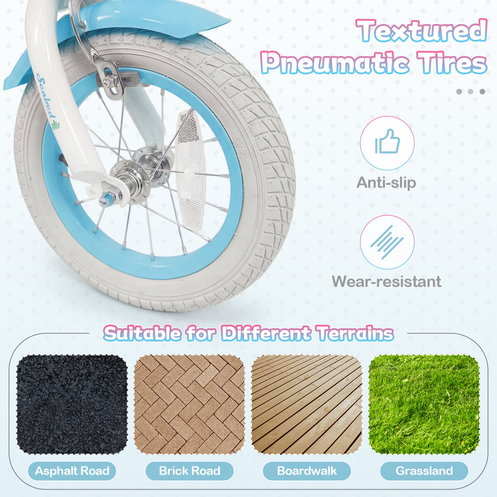 Textured pneumatic tires of the 12-inch kids bike in blue, suitable for various terrains like asphalt and grass.