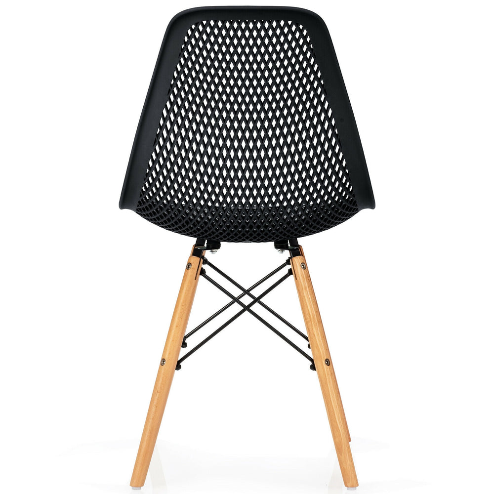 Black plastic hollow chair with beech wood legs, featuring a curved backrest for ergonomic support and breathability.